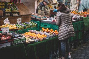 woman choosing fruits at the market